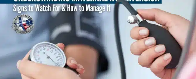 Doctor in a pink shirt holding a blood pressure monitor while checking the blood pressure of a seated patient wearing a blue shirt, with the cuff wrapped around the patient's upper arm in a medical office setting